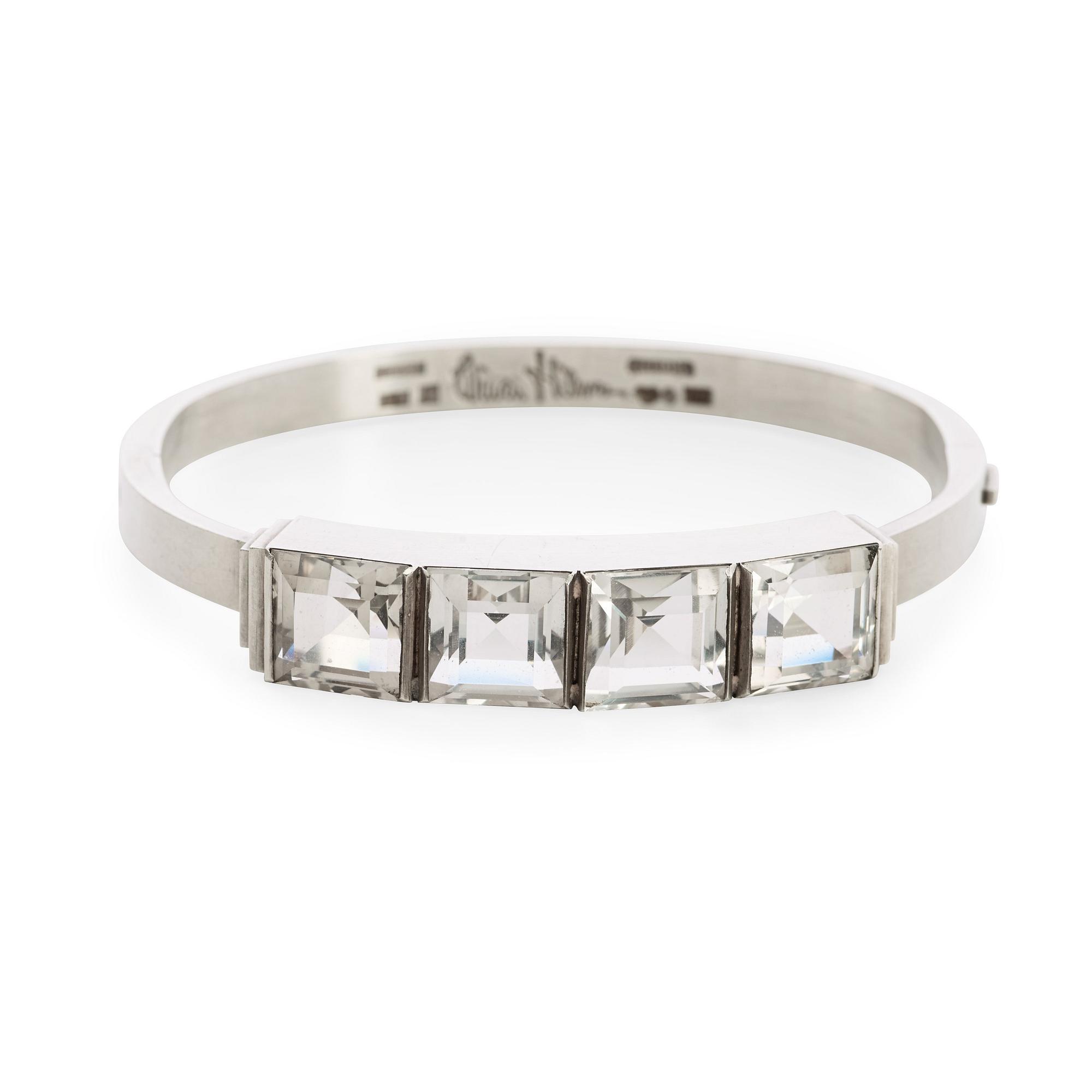 A Wiwen Nilsson sterling bangle with four facet cut rock crystals, Lund 1946.