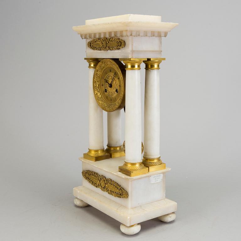 AN ALABASTER AND GILT BRASS TABLE CLOCK, mid 19th century.