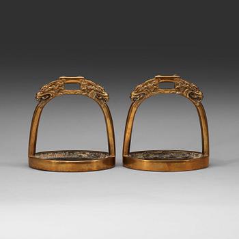 102. A pair of bronze stirrups, Qing dynasty, 19th Century.