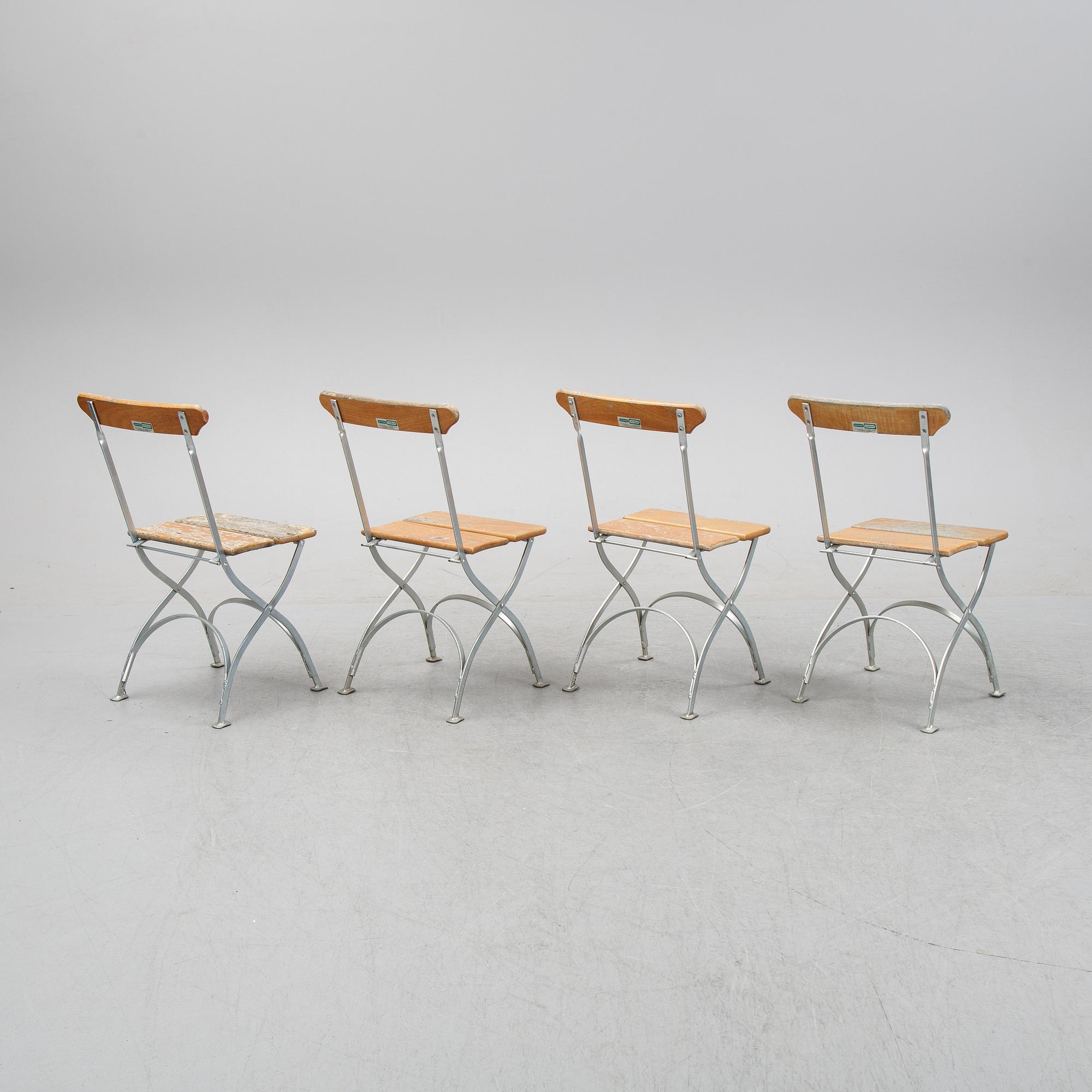 A set of four chairs and one table, Grythyttan, late 20th century.
