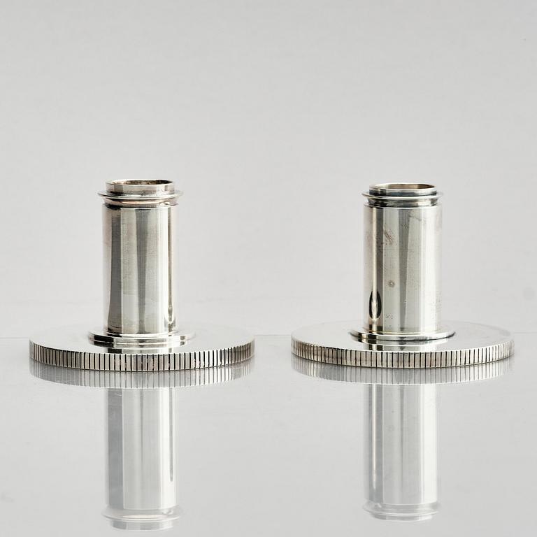 Georg Jensen, a pair of sterling silver candlesticks, design by Sigvard Bernadotte, model no 711A, Copenhagen, Denmark after 1945.