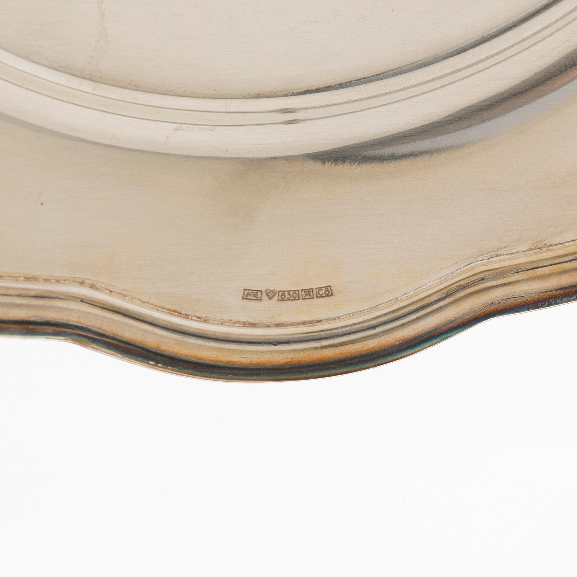 A 10-piece set of silver chargers, Kultateollisuus, Turku 1938 and 1980.