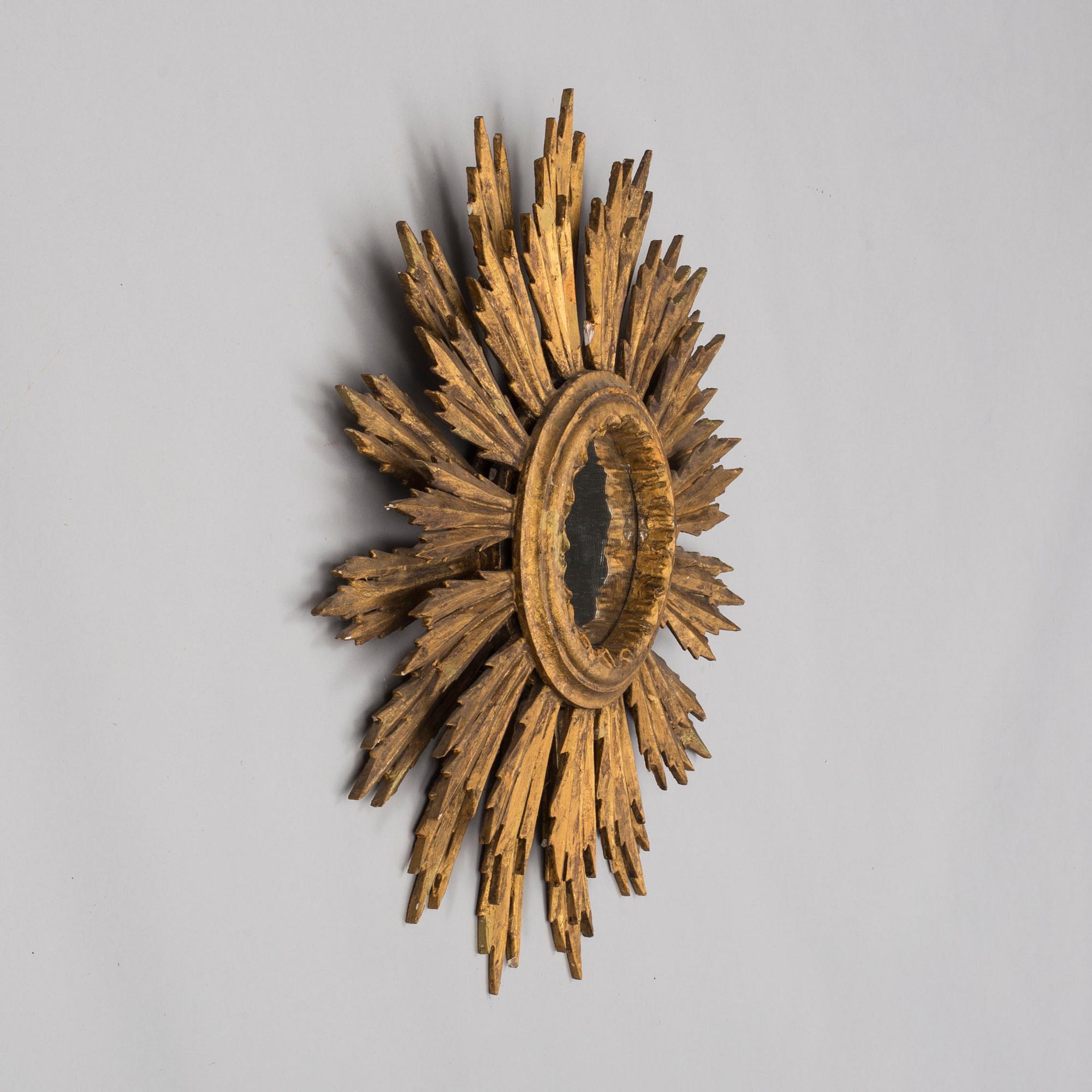 A first half of the 20th century sun mirror.