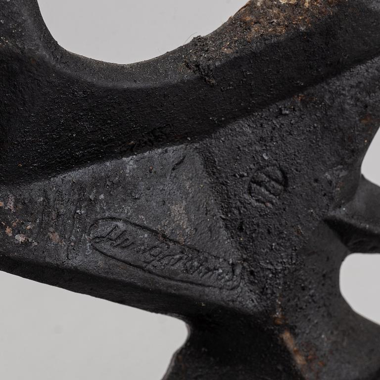 OLLE HERMANSSON, a cast iron sculpture, marked Husqvarna.