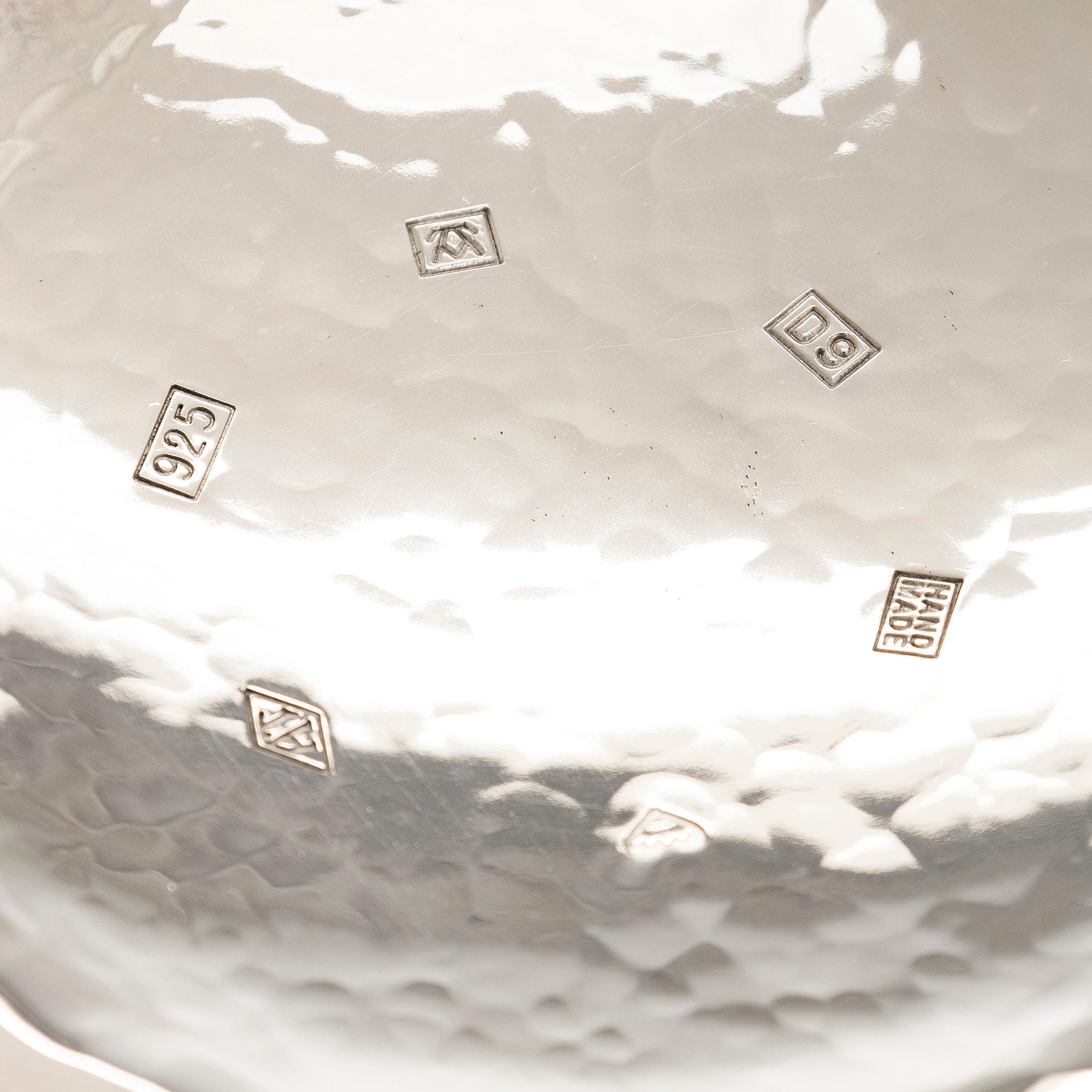 A set of three sterling silver and enamel bowls, maker's mark of A. Tillander, Turku 2005.