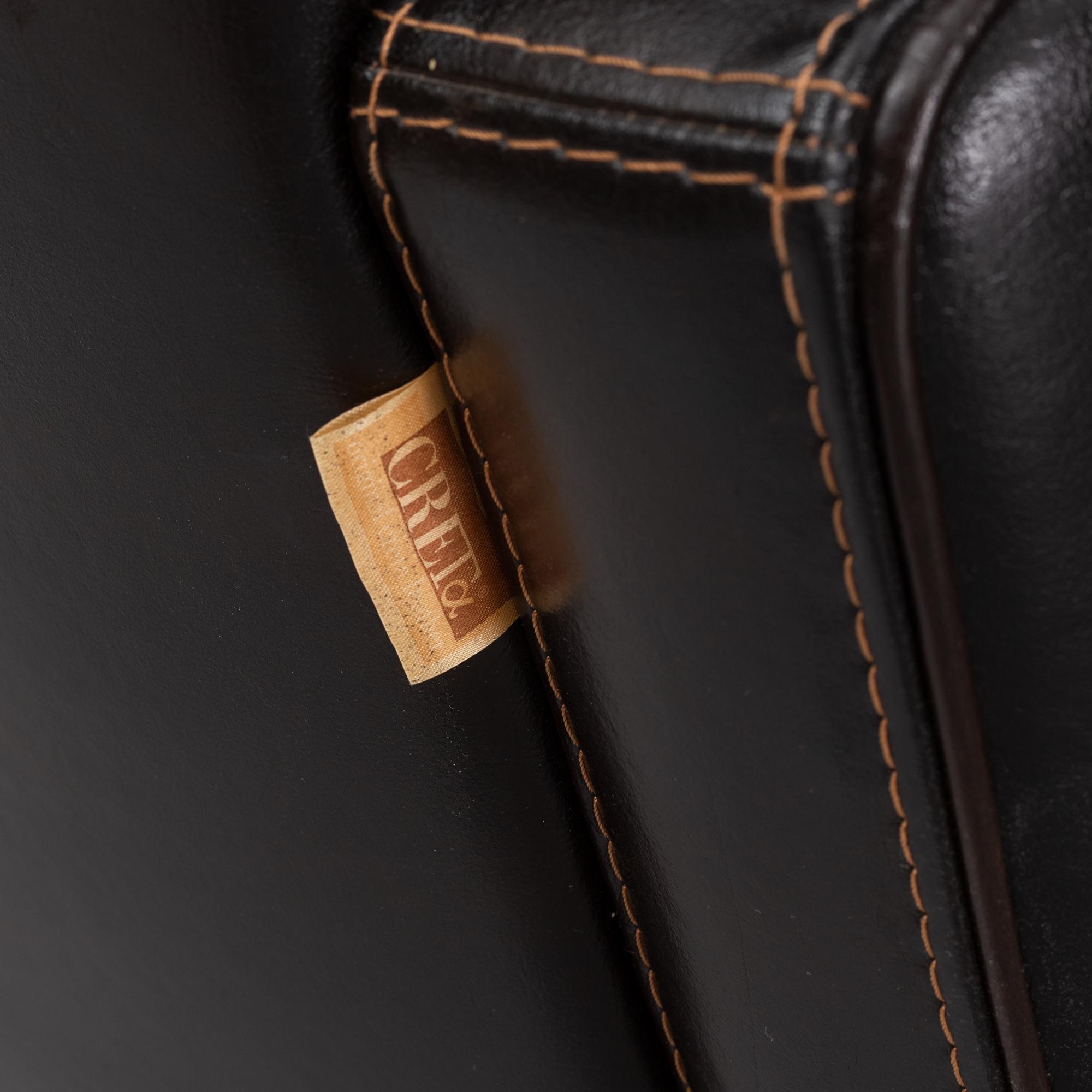 A pair of Italian leather armchairs from  Industria Divani e Poltrone, 21st-century.