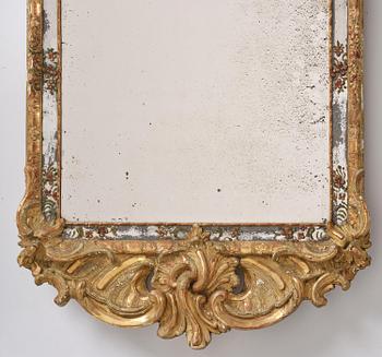 A Swedish giltwood and polychrome-painted Rococo mirror, later part of the 18th century.