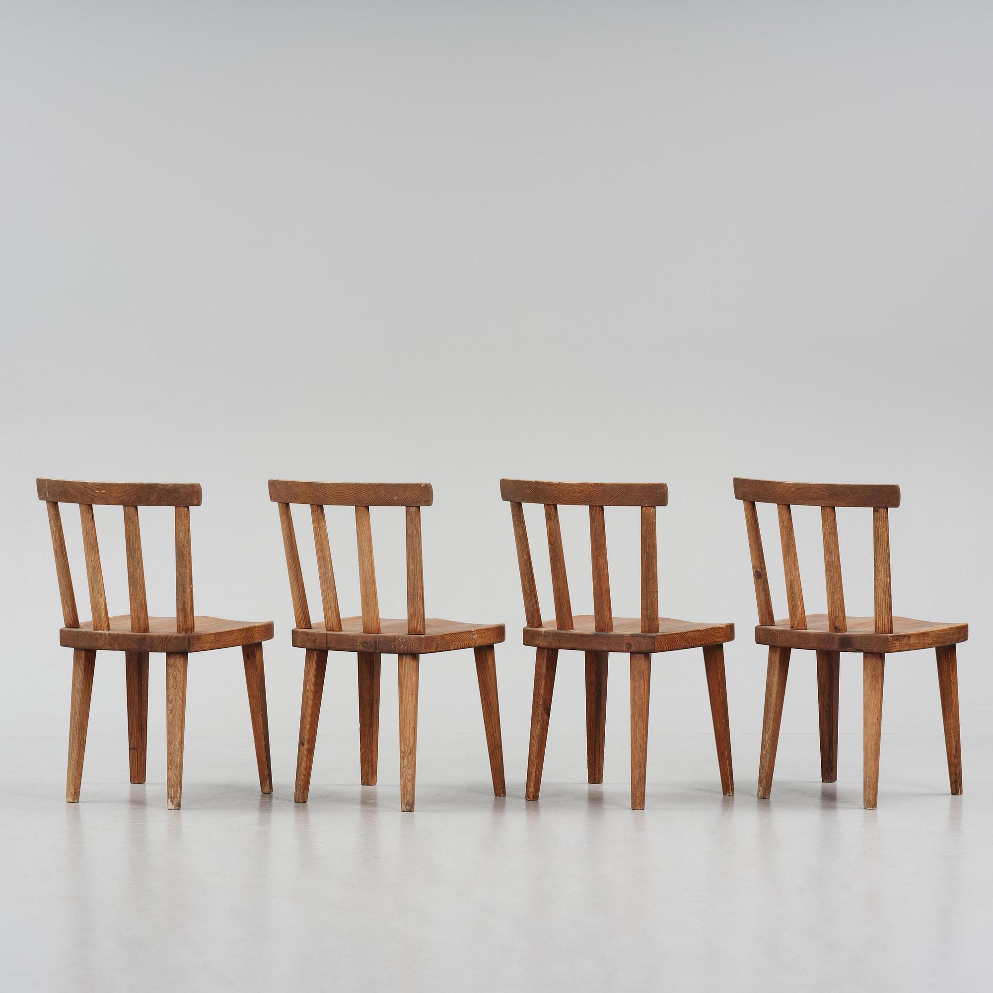 Axel Einar Hjorth, a set of four stained pine "Utö" chairs, Nordiska Kompaniet, Sweden, 1930s.