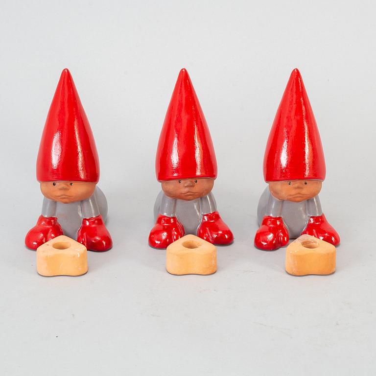 LISA LARSON, a set of seven earthenware candlesticks.