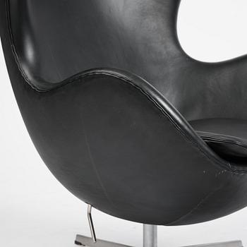Arne Jacobsen, an "Egg" chair with ottoman, Fritz Hansen, Denmark, 2001.