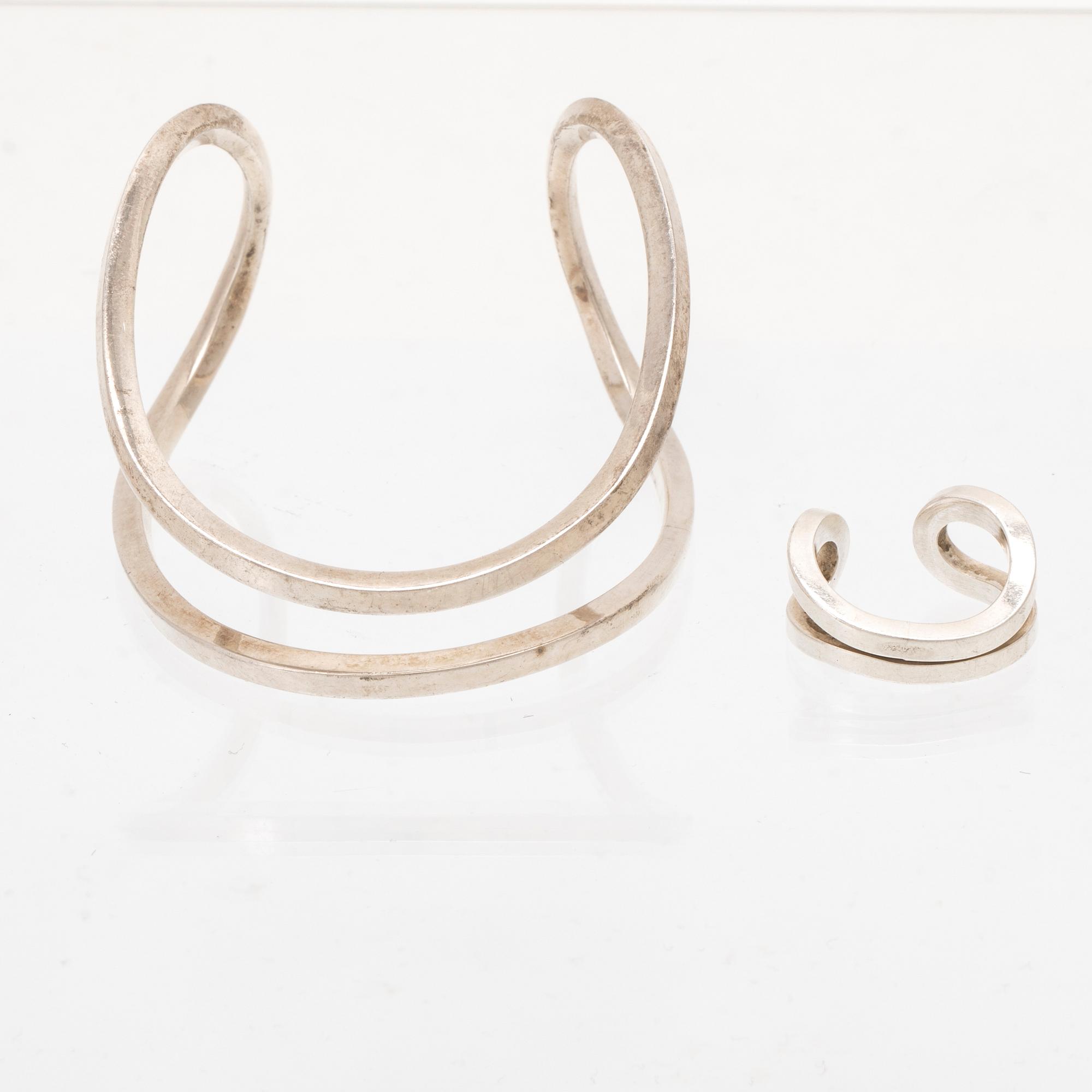 A silver ring and bracelet "loop cuff" by Efva Attling.
