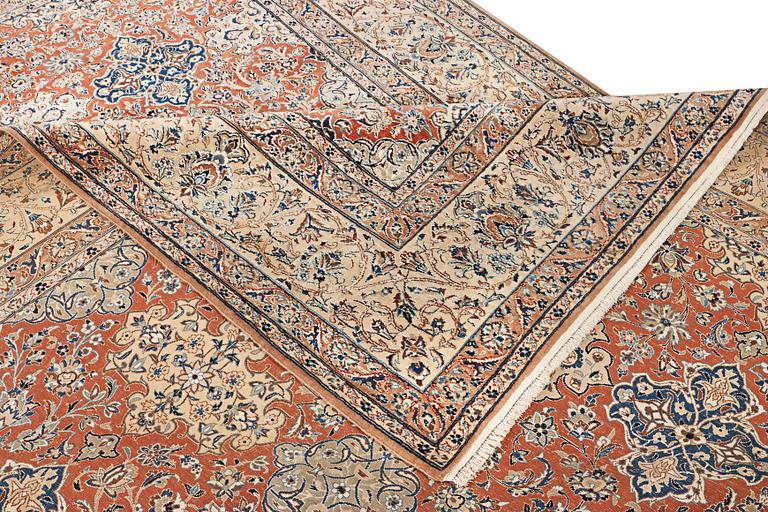 A semi-antique/old Nain carpet, part silk, c. 343 x 230 cm.