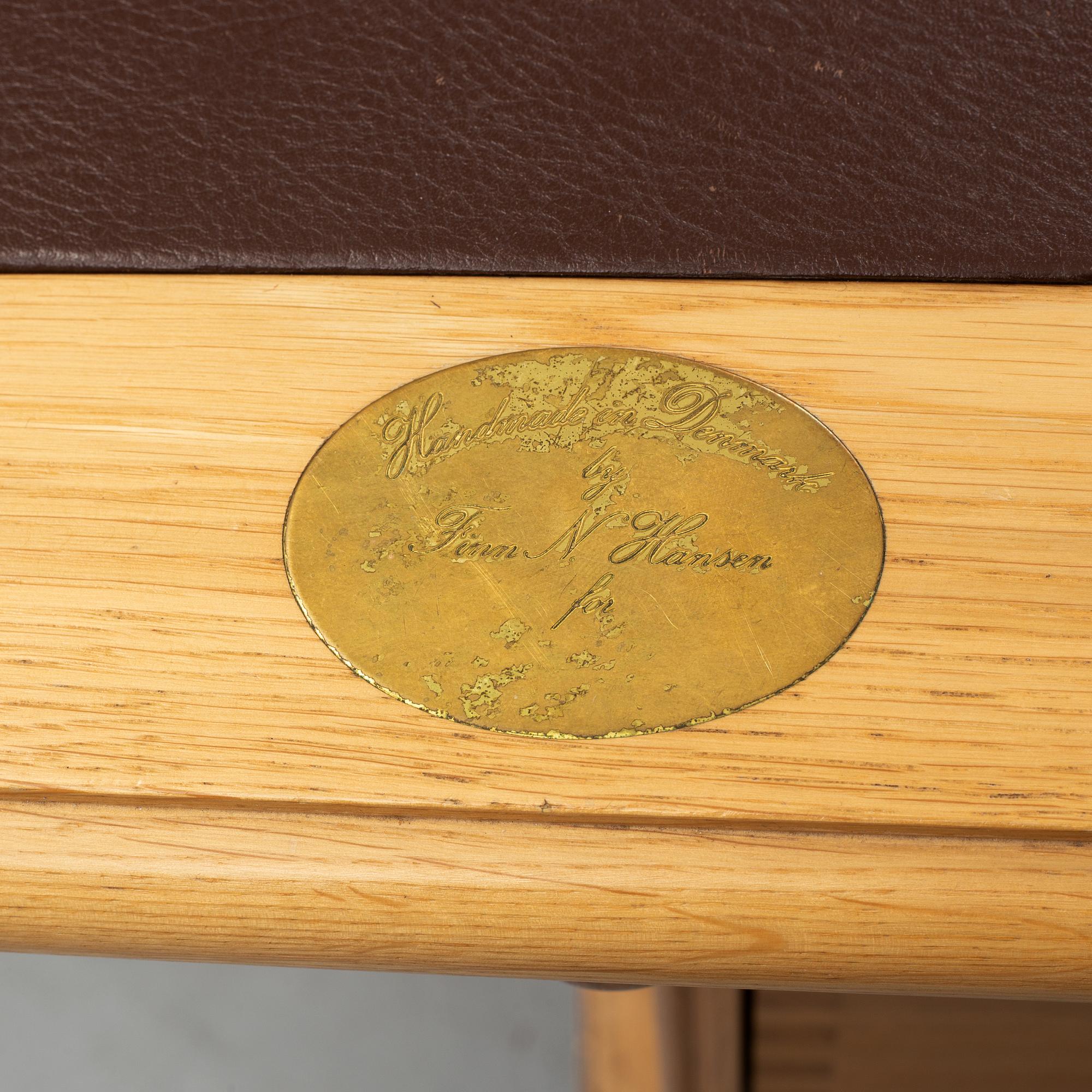 An oak writing desk by Finn N Hansen. End of the 20th Century.
