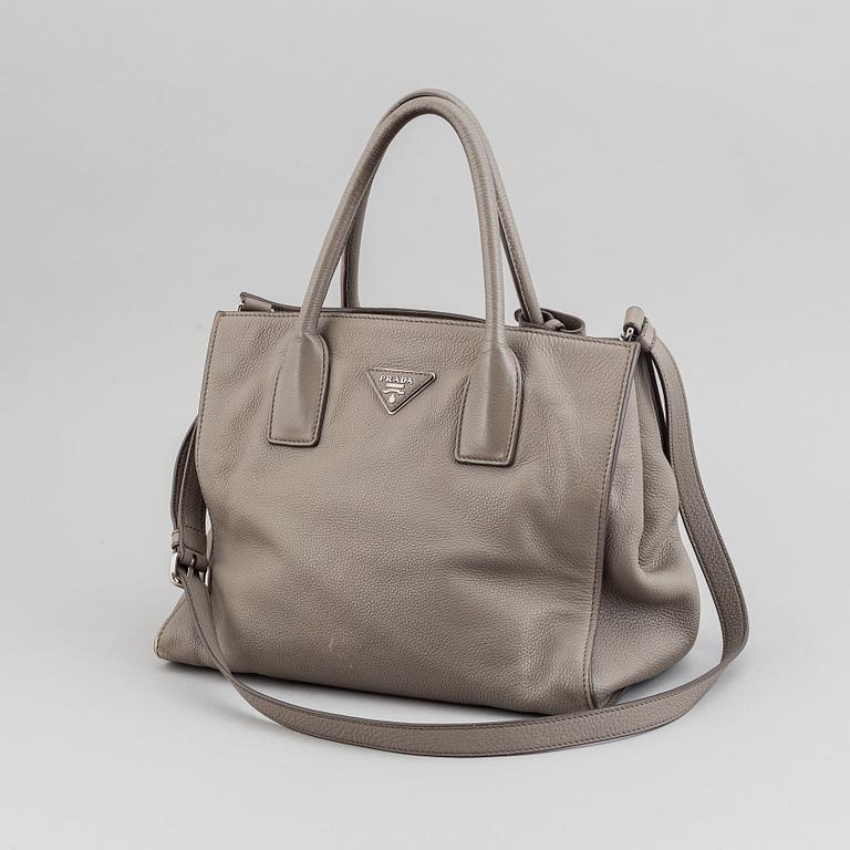 Prada, a leather handbag.