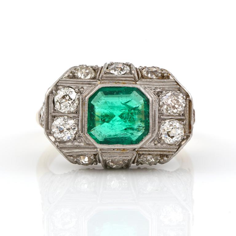 An Art deco, circa 0.70 ct, emerald and 1.00 ct old-cut diamond ring.