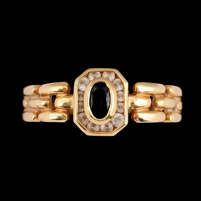 RING, 18 k guld med safir och mindre briljanter.