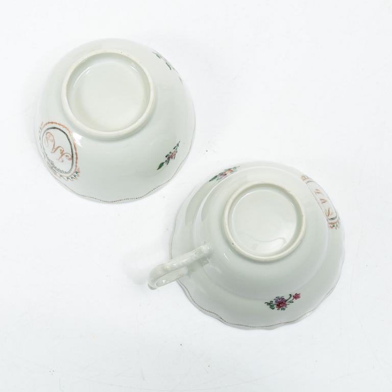 Cups and saucers, 11+7, and a teapot in famille rose with monogram, company porcelain, China, 18th century.