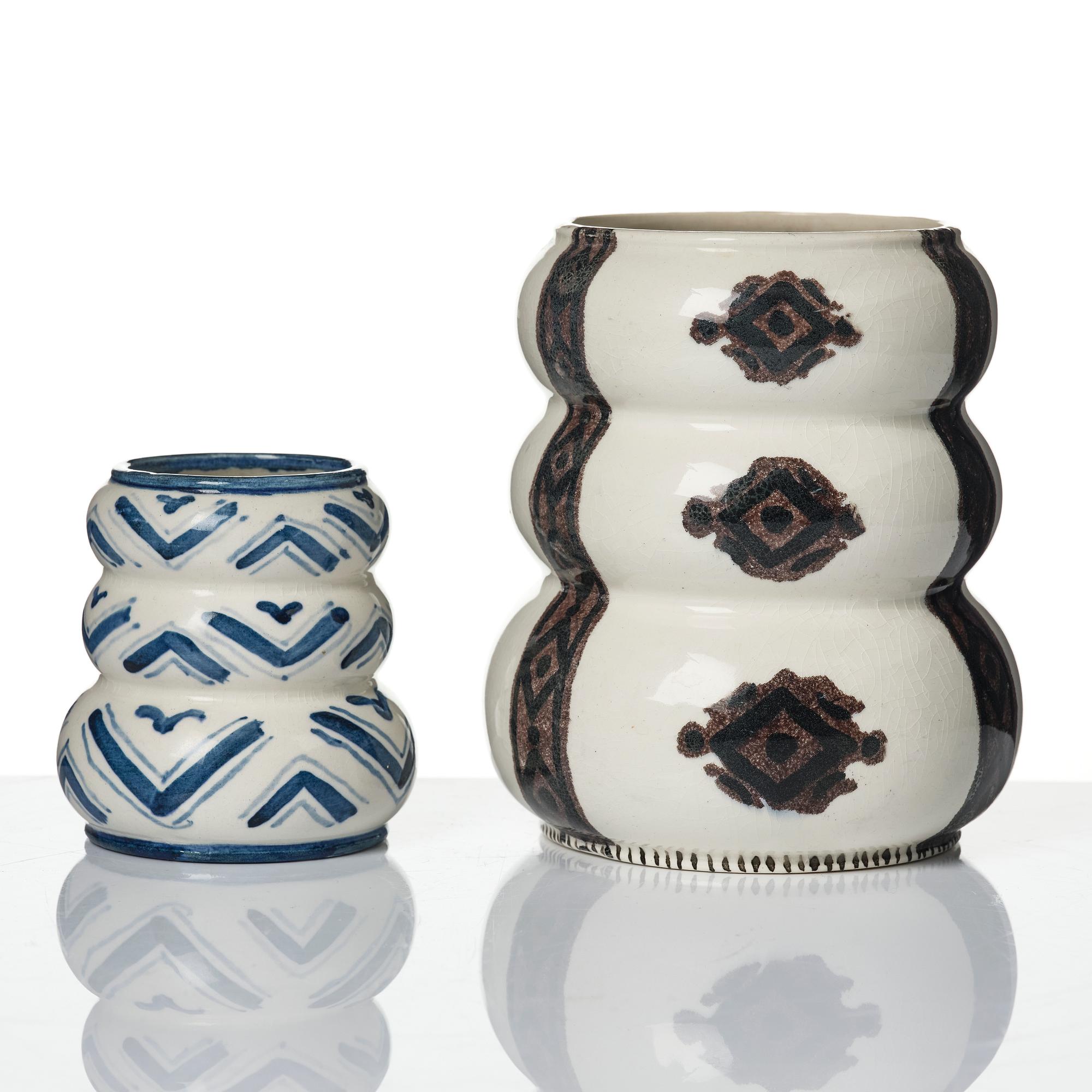 Wilhelm Kåge, a jar with cover, and four vases, creamware and porcelain, Gustavsberg, Sweden, 1917-1920.