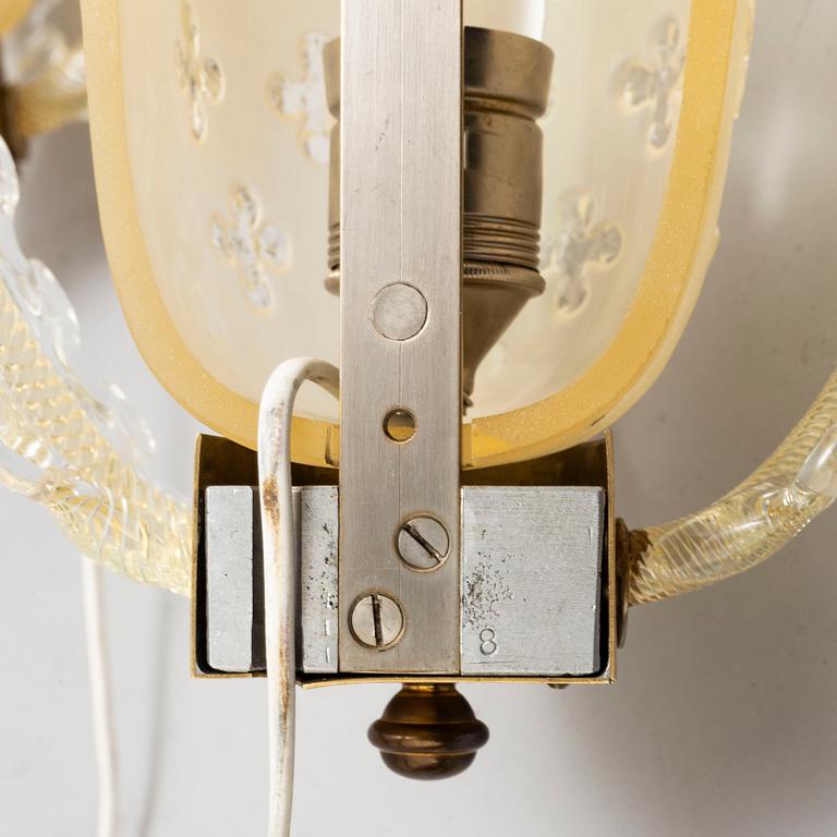 a pair of glass wall lamps from Orrefors in the mid 20th century.