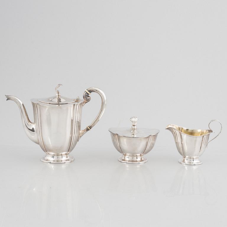 A Swedish Silver Coffee Pot, Creamer and Sugar Bowl, mark of GAB, Stockholm 1928-30.