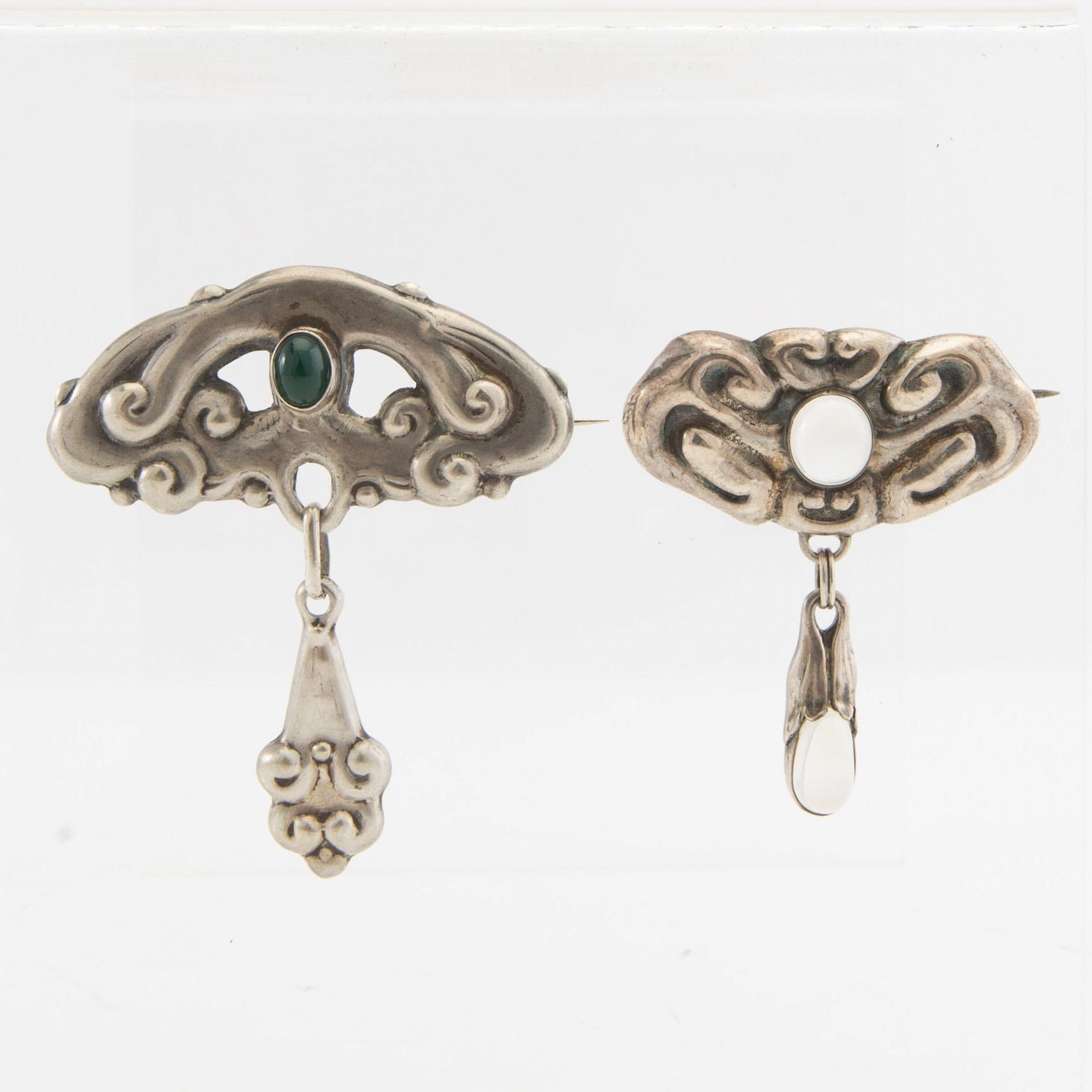 Brooches, 2 pieces, Art Nouveau, early 20th century, pewter, moonstone, and green stone.