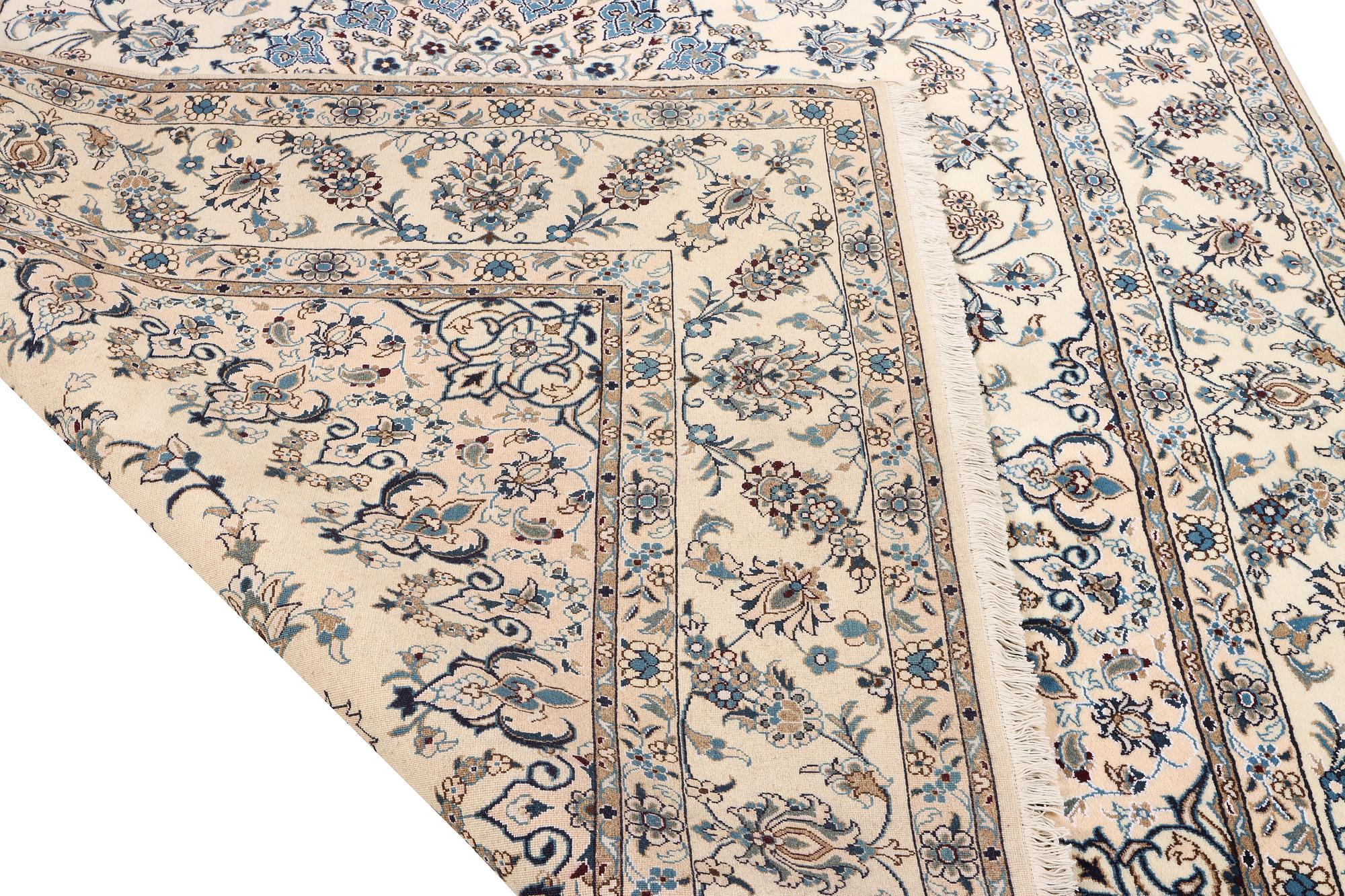 A Nain, part silk carpet, c. 337 x 244 cm.
