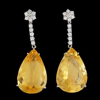 250. A pair of drop cut yellow opal and brilliant cut diamond earring, tot. app. 1.50 cts.