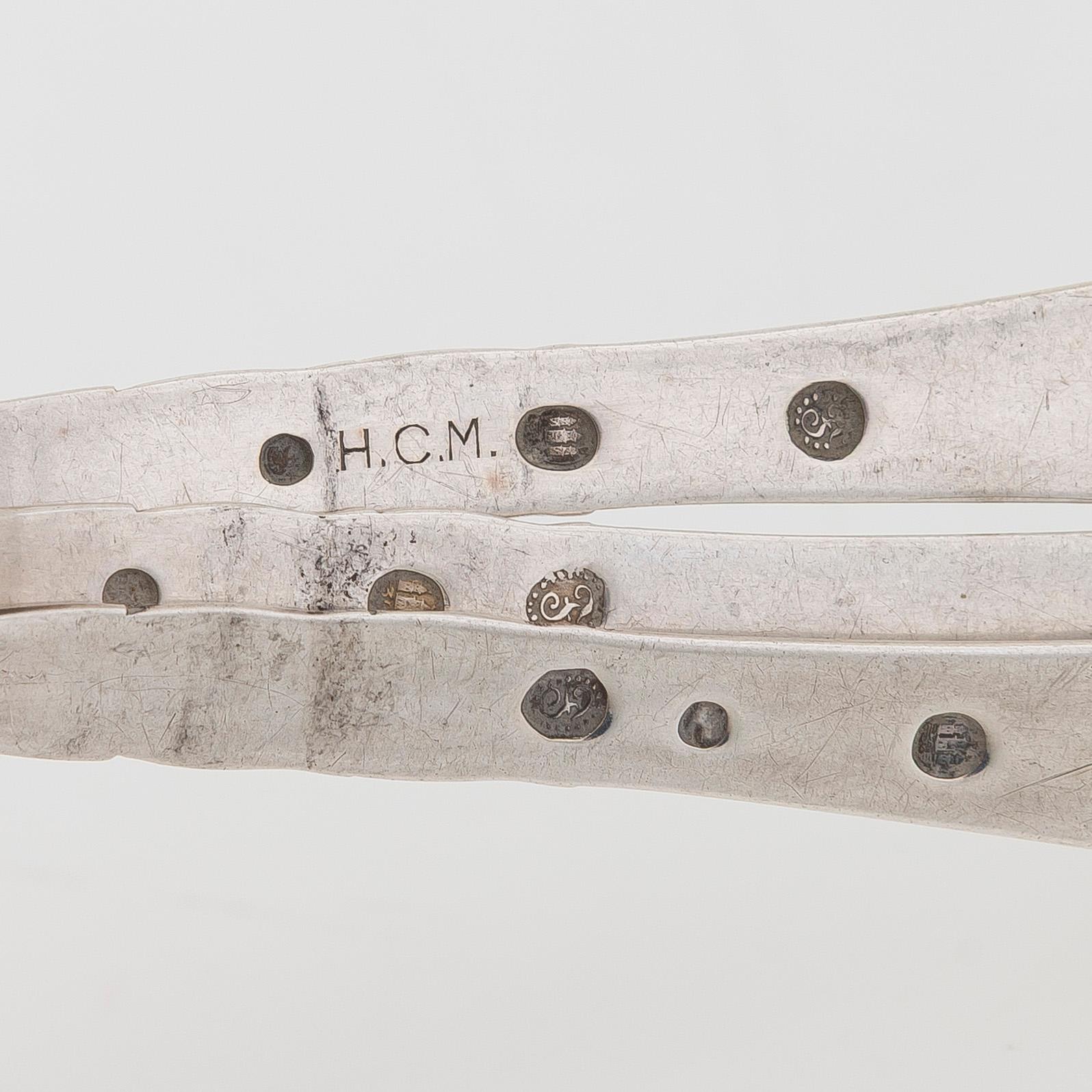 A set of  four silver serving spoons, with a set of 12 coffee spoons, Denmark, early and first half of the 20th century.