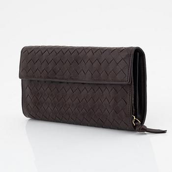 Bottega Veneta, a brown leather wallet.