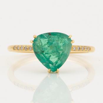 Triangle shaped emerald and brilliant-cut diamond ring.