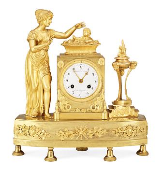 549. A French Empire early 19th Century mantel clock.