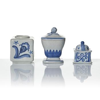 Wilhelm Kåge, eleven pieces of faience including jars, inkwells and a tulip vase, Gustavsberg, Sweden, 1919-1920.