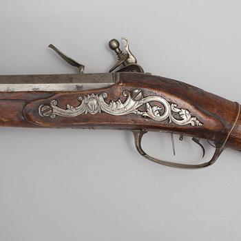 A 18th century flintlock rifle.