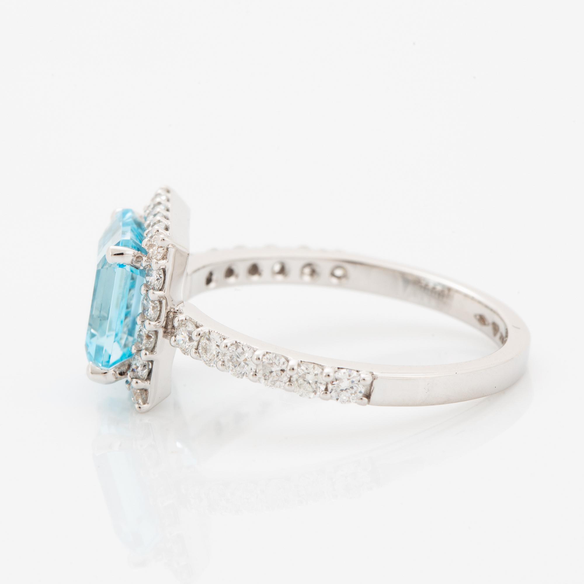Blue topaz and brilliant-cut diamond ring.