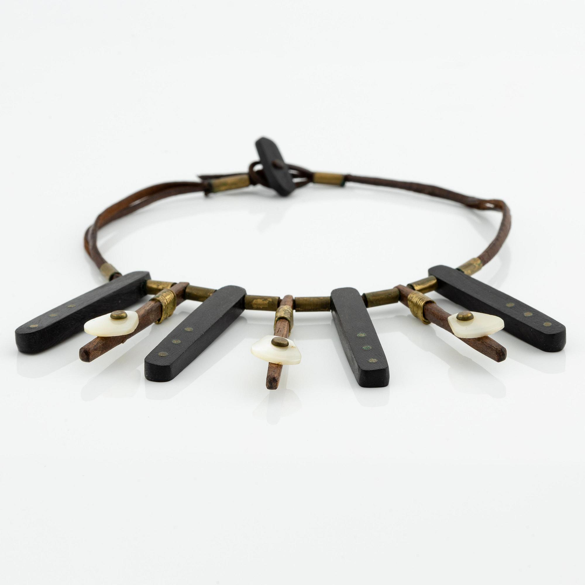 Vivianna Torun Bülow-Hübe, a necklace, wood, leather, mother-of-pearl and brass, most likely 1950's.