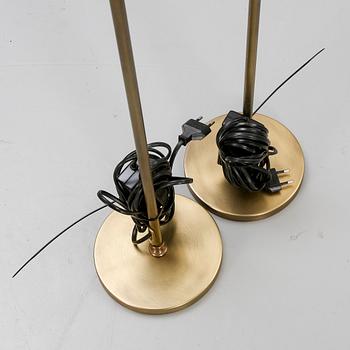 A pair of brass floor lamps 21 st century.