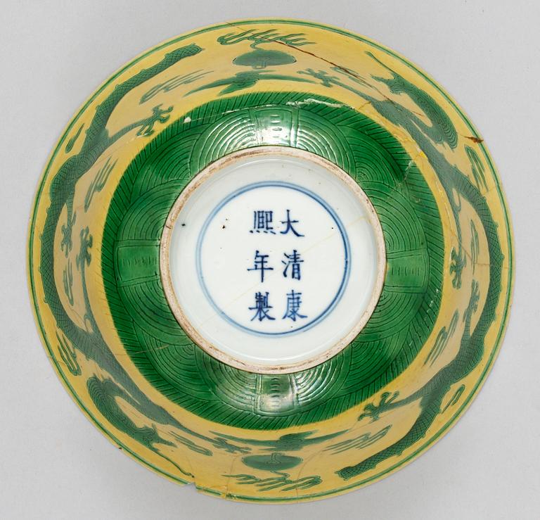 A pair of yellow ground 'dragon bowls', Qing dynasty, with Kangxis six character mark.