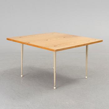 A coffee table marked Tapio Wirkkala, Asko, Made in Finland.