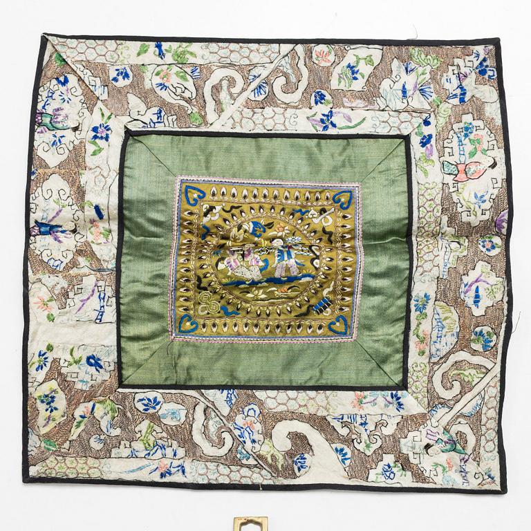 Three Chinese lacquer and wooden panels, two silk embroideries, first half of the 20th century.