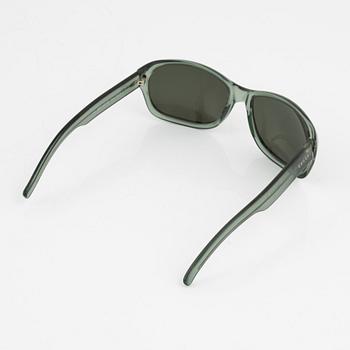 Gucci, a pair of green sunglasses.