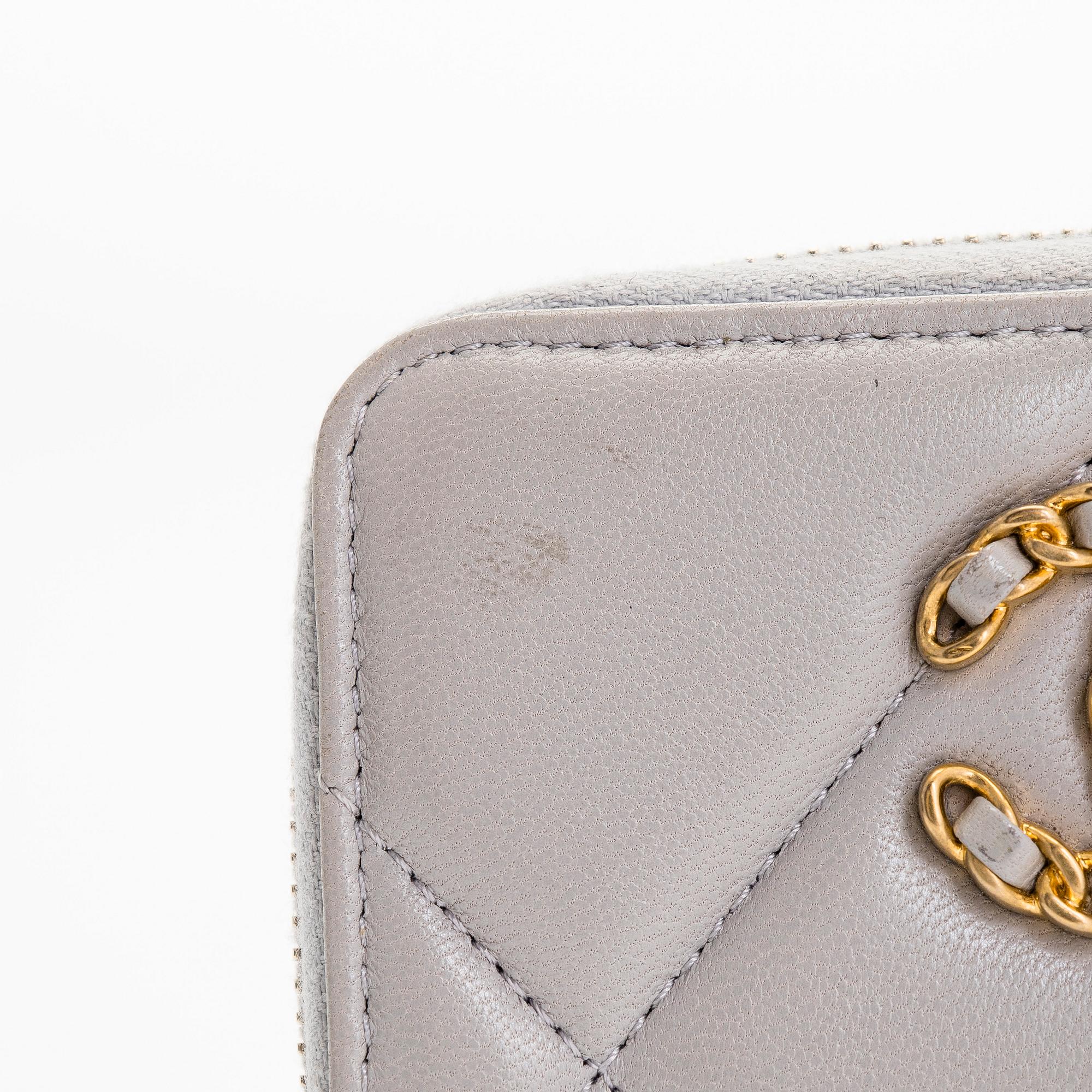 Chanel, A "19 O-coin purse" wallet.