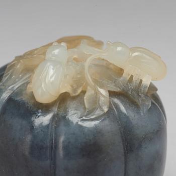 A Chinese nephrite sculpture of insects on a fruit.