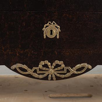 A gustavian style chest of drawers, early 20th century.