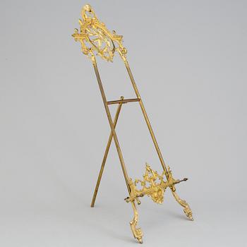 A gilt metal table easle, late 19th Century.