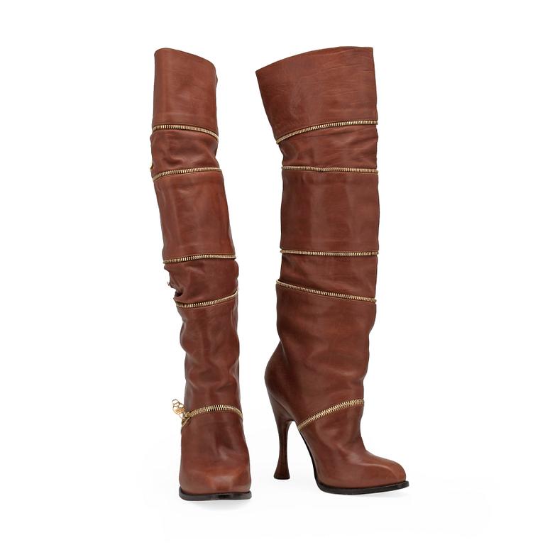 ALEXANDER MCQUEEN, a pair of brown leather boots.