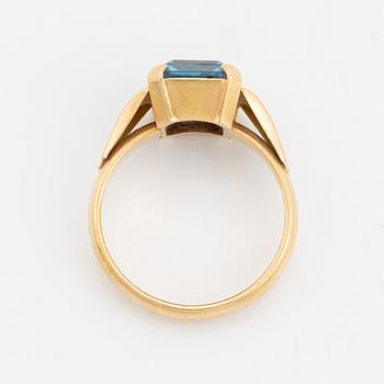 18K gold and synthetic blue spinel ring.