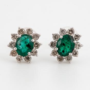 Emerald and brilliant-cut diamond cluster earrings.