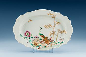 1570. A famille rose 'peacock' serving dish, Qing dynasty, Qianlong (1736-95).