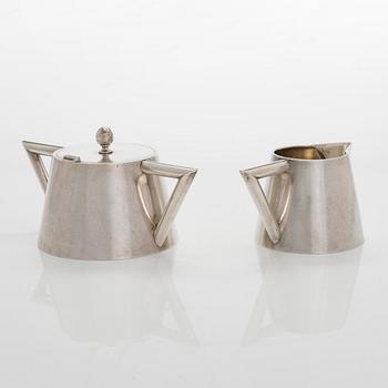 K. Fabergé, a silver sugar bowl and cream jug, Imperial Warrant mark, Moscow ca. 1913.