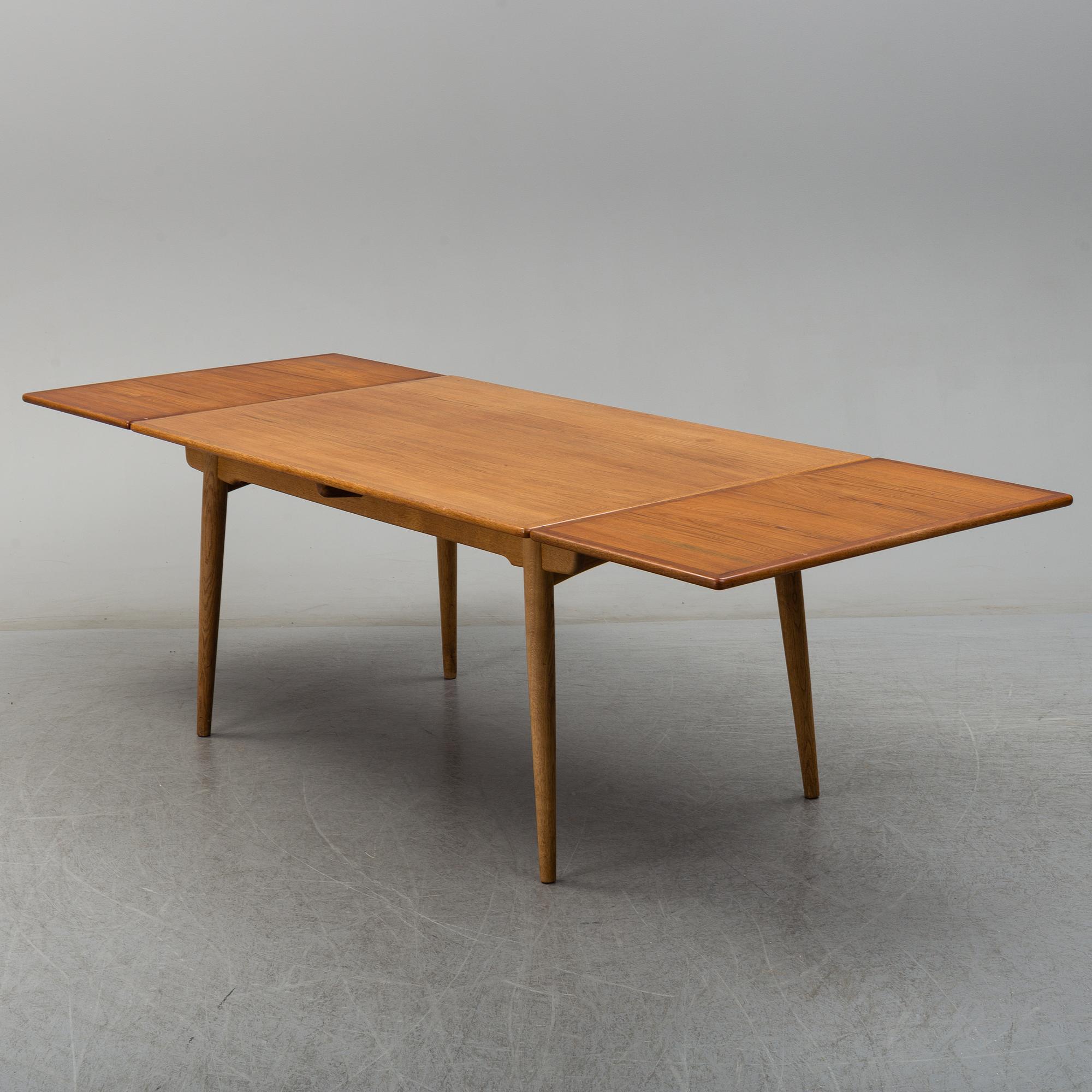 HANS J WEGNER, a model 'AT312' teak and oak dining table from